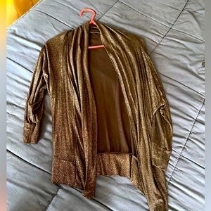 Shiny cover up, thin. Worn once